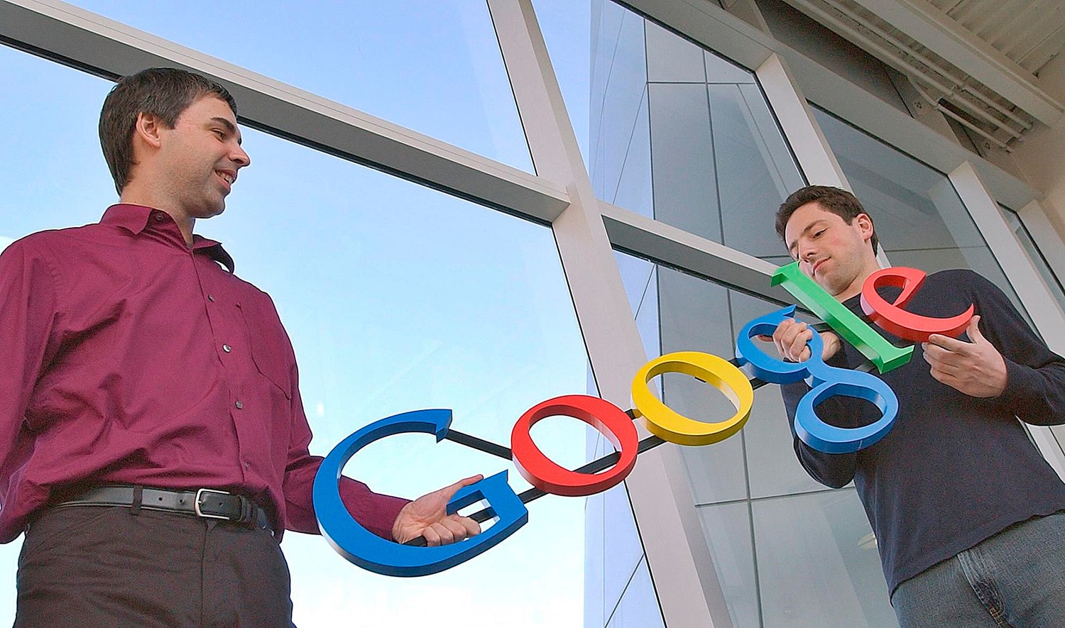 FILE- In this Jan. 15, 2004, file photo Google co-founders Larry Page, left, and Sergey Brin pose for a photo at their companys headquarters in Mountain View, Calif. Twenty years after Page and Brin set out to organize all of the internet’s information, the search engine they named Google has morphed into a dominating force in smartphones, online video, email, maps and much more. (AP Photo/Ben Margot, File)